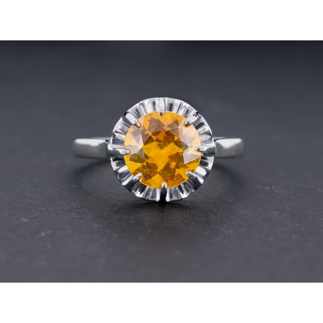A sun kissed tangerine dream! This exceptional 2.88ct GIA certified natural sapphire exhibits a bright yellowish orange...
