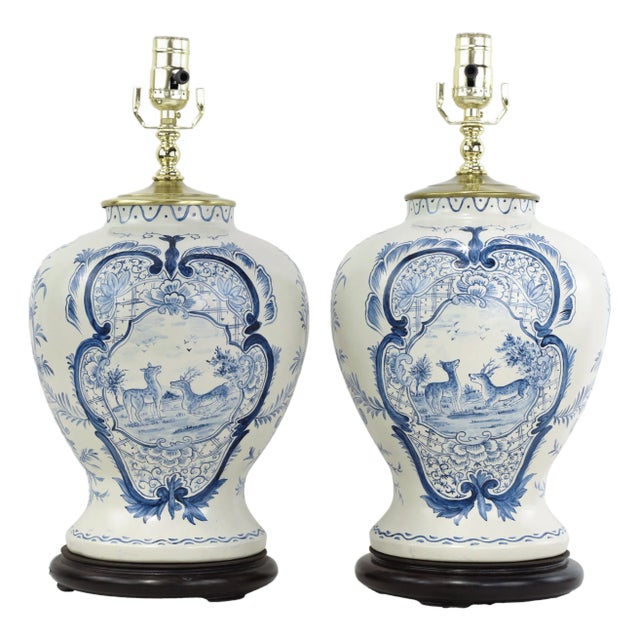 Pair of Vintage Hand Painted Blue and Cream Ceramic Table Lamps With Deer and Floral Folk Art Design For Sale
