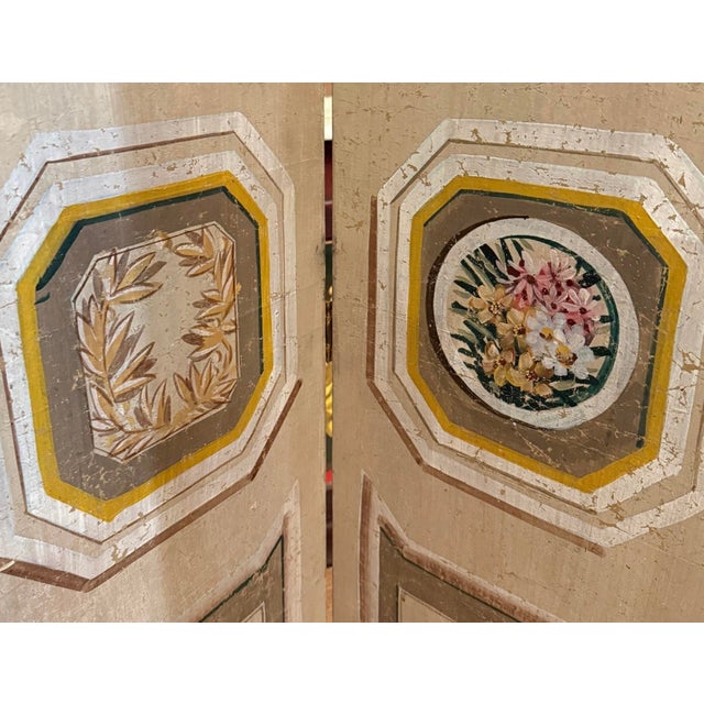 This is a mid-century Italian French Louis XVI style hand painted wall paper folding screen or room divider. Each panel is...