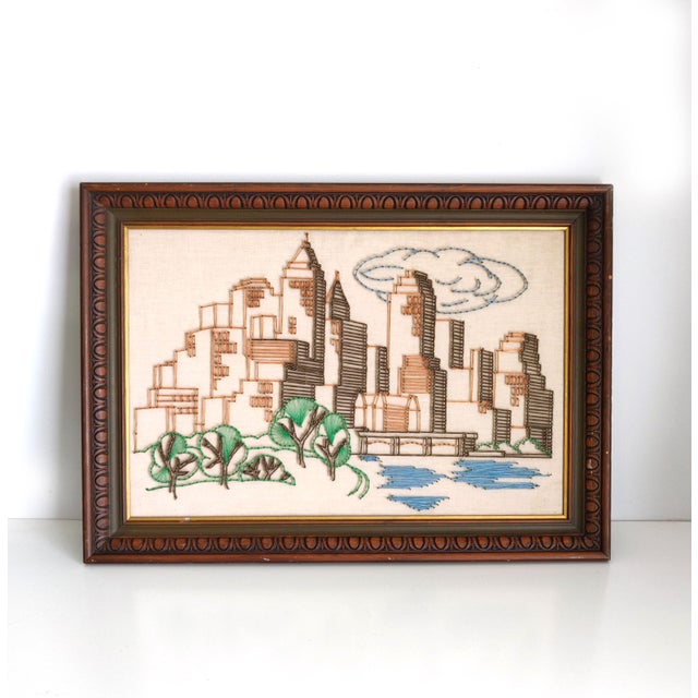 Framed nail and string art A wonderful example of the nail and string art done in the 1970s. This piece features a city...