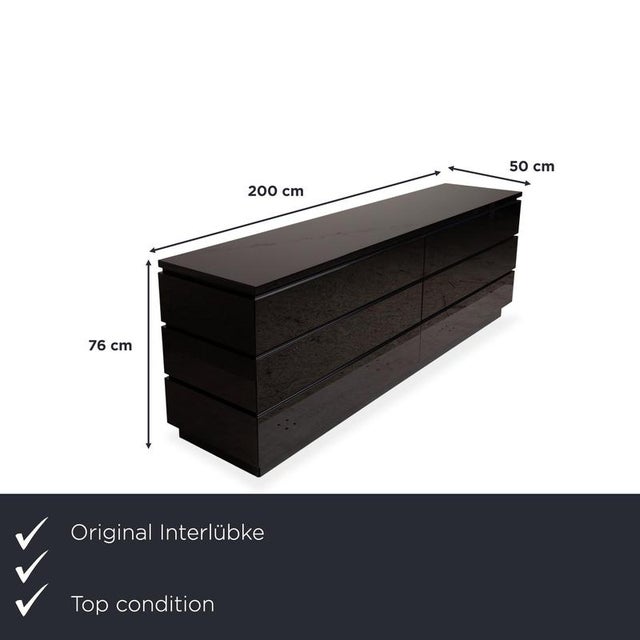 with the Interlübke Cube, you're bringing home a sideboard that truly impresses with its uncompromising clarity. We're...