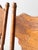 A warm and substantial set of five vintage oak dining chairs with carved crest rails, turned spindles, and classic Early...