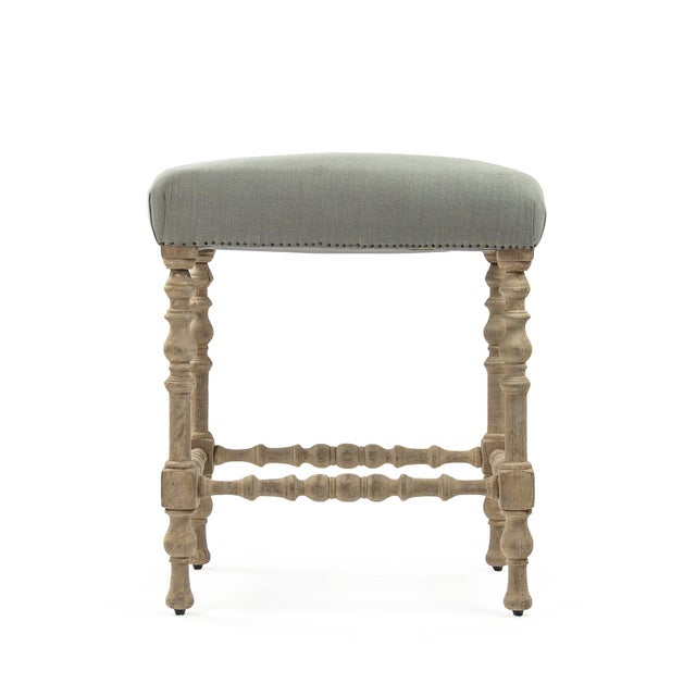 The Giselle Bar Stool from Zentique is a French country backless bar stool with a seafoam green raw silk padded seat...