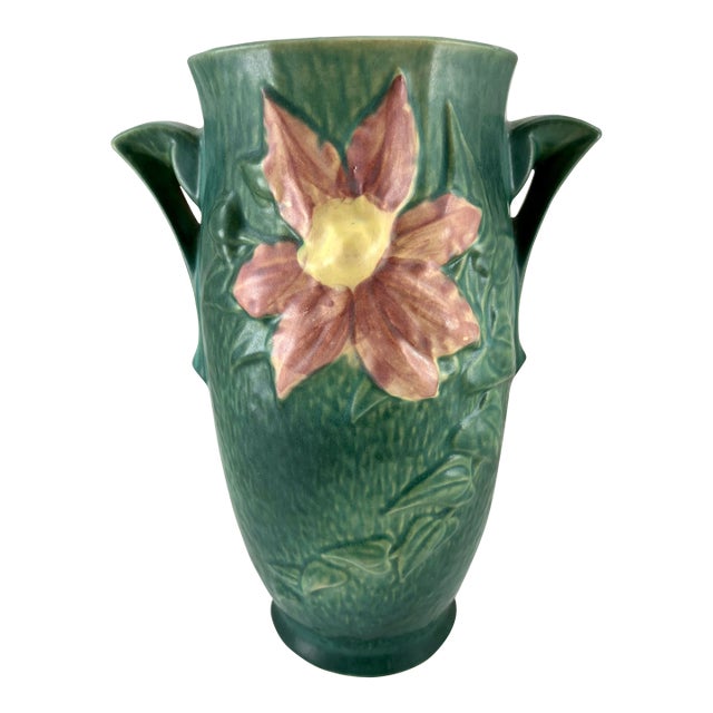 Here we have a Roseville Clematis vase 112 done on a green background. The lovely vase stands 12.5" tall.. There are no...
