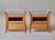 This matched pair of Italian postwar bedside tables is constructed in blonde walnut with four splayed, outward-curving...