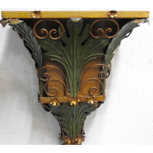 Leaves, scrolls, vines and flowers embellish this metal planter from Italy. Most of the surface is finished in a patinated...