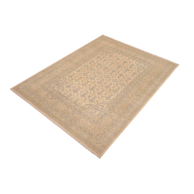 Enhance the ambiance of your home with this magnificent Persian-influenced Turkish hand-knotted rug made by skilled...