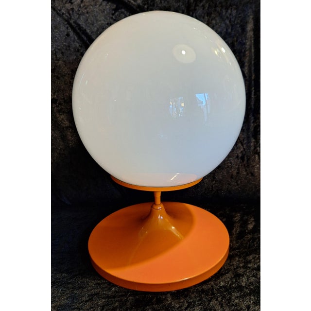 Space Age Table Lamp with Orange Metal Base and Round White Glass Shade, 1970s, in Very Good conditions. Designed 1970 to...
