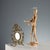 Small bronze table mirror with plant motifs and scrolls. This piece is attributed to the mentioned designer/maker. It has...