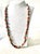 Stunning, long vintage turquoise and coral Native American beaded necklace with sterling silver clasp. Length: 28”