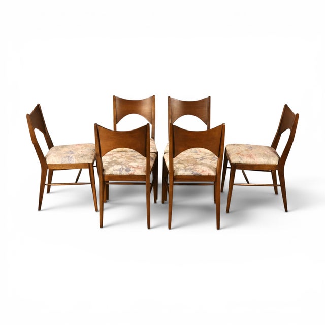 This 1960s set of six Broyhill Saga dining chairs captures the collection at its most sculptural. Each walnut back is cut...