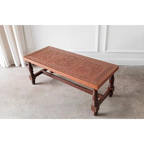 Designed to anchor a space, this sculptural leather-topped coffee table/bench works beautifully in a living room, an...