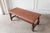 Designed to anchor a space, this sculptural leather-topped coffee table/bench works beautifully in a living room, an...