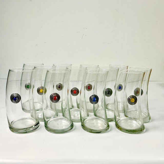 We love these tall tumblers. How fun and chic the bent glass shape will be to impress your guests. They are certainly...
