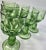 These frosty light green goblets are springtime in bud. The base is a leafy flower base over an opening flower. The...