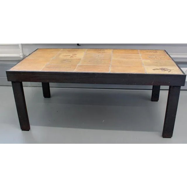 A classic and collectible rectangular coffee table by renowned french ceramicist roger capron, created in the 1970s in his...