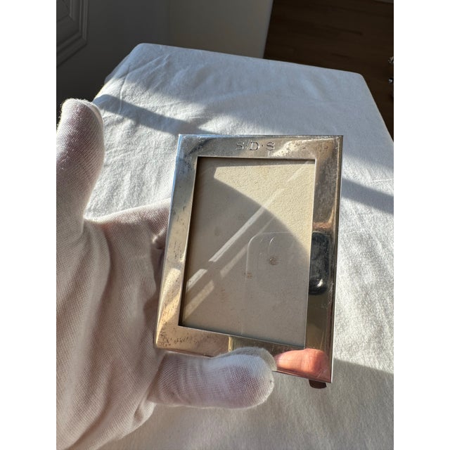 Authentic Tiffany & Co. sterling silver picture frame, marked Maker 23937 SDS, measuring 4×3 inches. Featuring a timeless,...