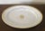 Large antique French Empire Paris porcelain oval platter decorated in white & gold with a central flower head. Measures 19...