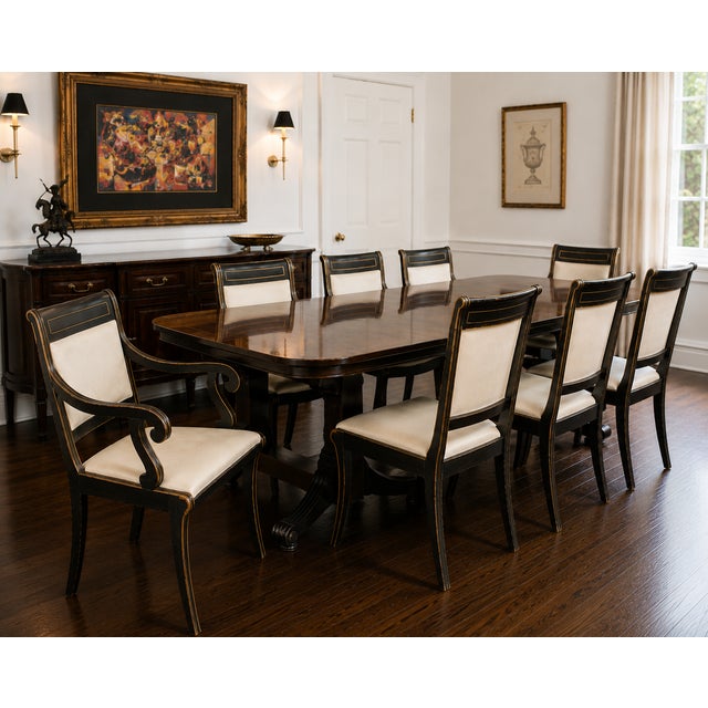 An exceptional set of eight vintage Kittinger dining chairs dating to the 1950s, comprising six side chairs and two...