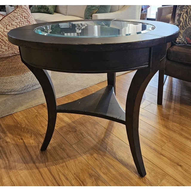 Fremarc Round End table in Antique Brittany finish. No hand rub/Matte on finish-- Not glossy. Glass is bevelled.