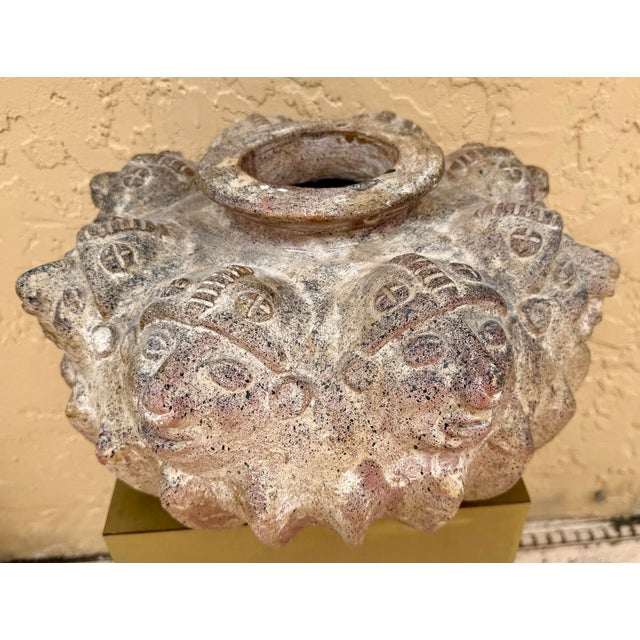 Rare, large antique hand crafted vase with a very detailed and unique design of perpetual faces from the pre-columbian...