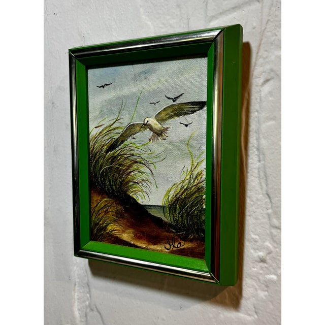 While it may be small in size, this original oil painting by Ila McNabb, is big on detail. Set on “A Windy Day” in sand...