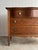 Antique oak chest of drawers with a softly shaped top and serpentine drawer fronts, the surface showing pronounced...