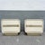 A striking pair of Postmodern nightstands featuring sleek cream gloss laminate construction with softly rounded waterfall...