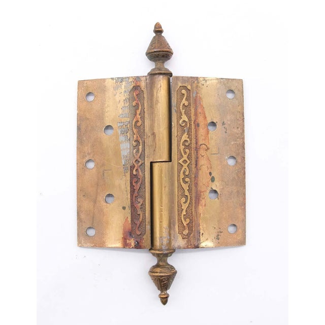 Victorian bronze lift off butt door hinge with steeple tips, a staggered hole pattern, and two knuckles. This is in...