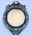 This fabulous 19th century circular-shaped beveled mirror, featuring Champlevé enameling with a floral design, is approx...