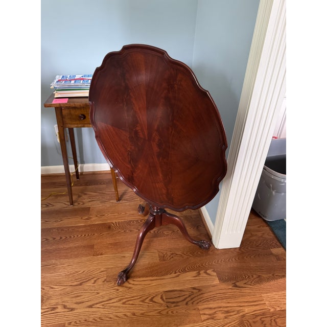 Excellent condition. Beautiful scalloped pie crust table top, on three legs. Sturdy and strong. Approx 24” diameter x 29”...