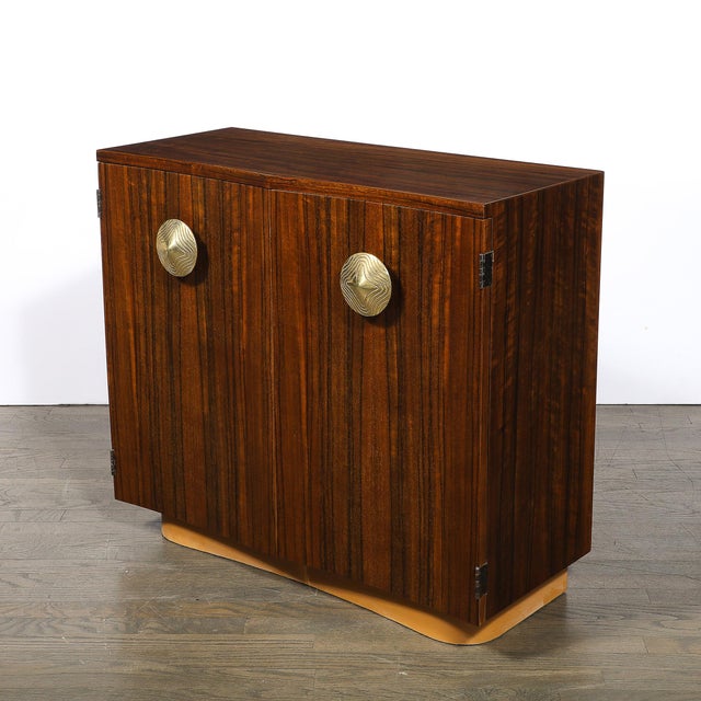 This exceptional Art Deco cabinet, designed by the legendary Gilbert Rohde and crafted in America circa 1940, epitomizes...