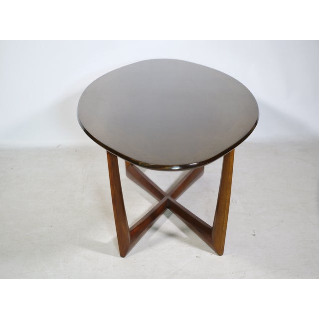 Oval coffee table by Kondor Möbel, Germany, 1960s. Large elliptical walnut tabletop with a striking crossed base and a...