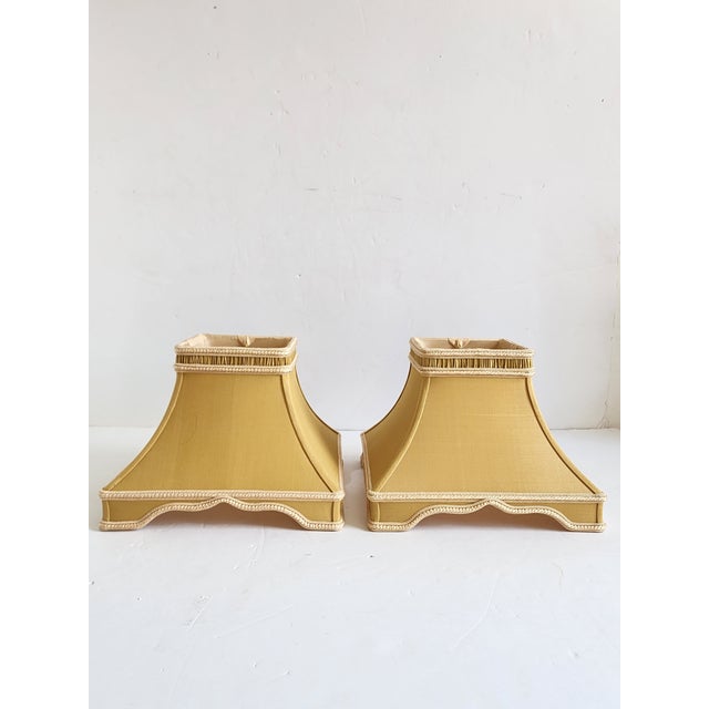 Pair of square form lamp shades, with triple silk braid and pleats accent in a tan fabric and silk trims by Chelsea House...