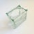 A unique vintage vase made from a glass block. A rounded rectangular opening has been cut into the top for use as a vase....