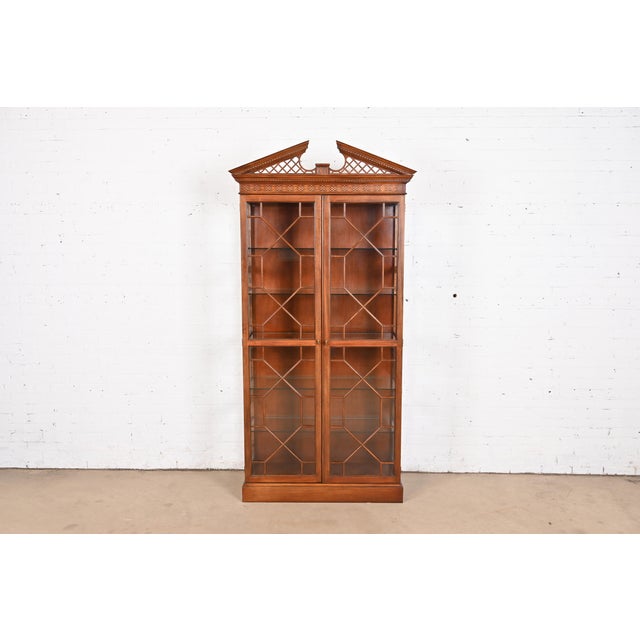 A gorgeous Georgian or Chippendale style lighted breakfront bookcase or display cabinet By Baker Furniture USA, Circa...