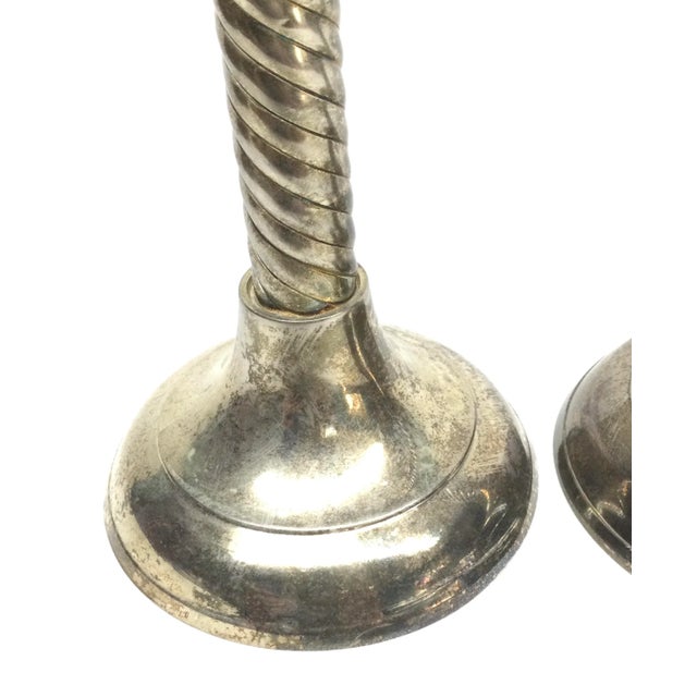 Gorgeous set of twisted pillar candle holders. Very stable and will definitely add style to your table. We leave these...