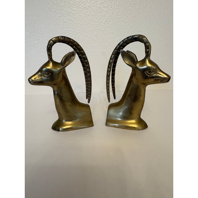 These mid-century modern bookends are very popular in the design of a Hollywood Regency style homes. Made of solid brass...
