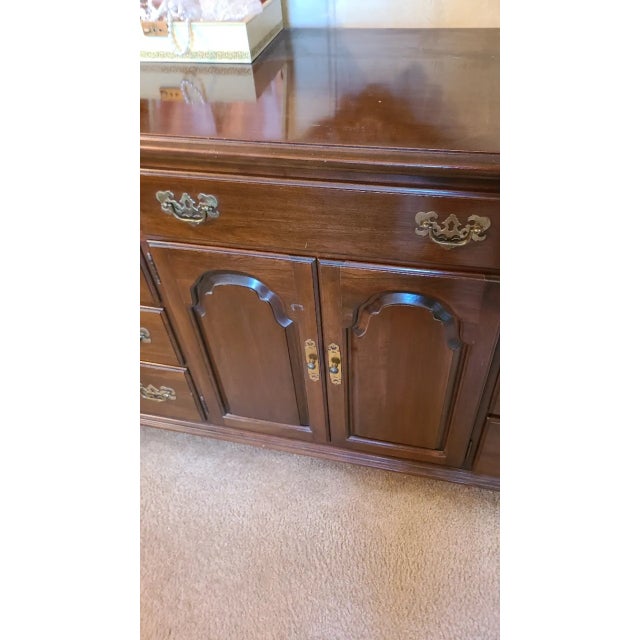 Ethan Allen Georgian court dresser. Solid cherry wood triple dresser .. All drawers in perfect condition. Part of a...