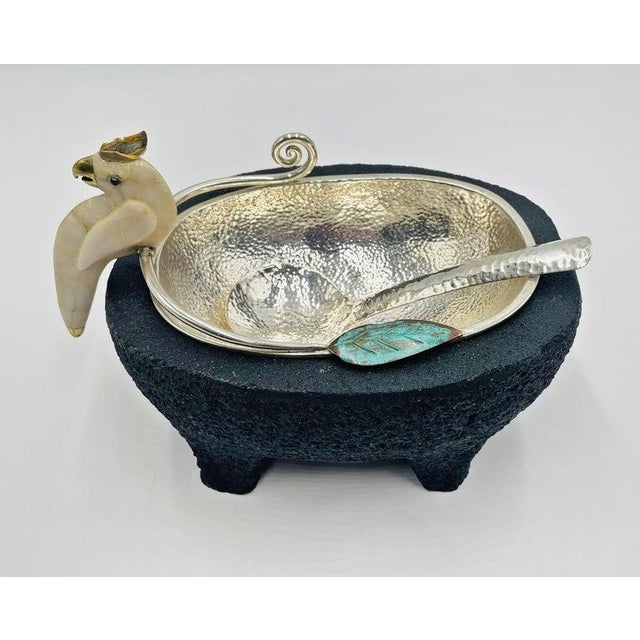 A whimsical and sculptural silver-plated serving bowl with volcanic rock base designed and handcrafted by Emilia Castillo...