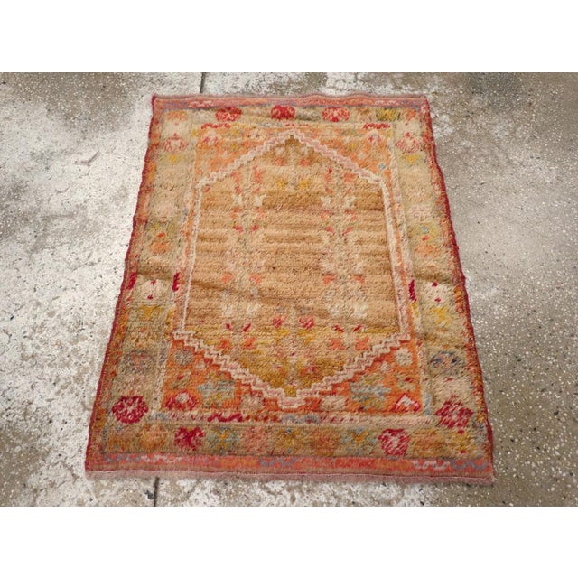 An antique Turkish Angora Oushak throw rug handmade during the Early 20th century. Measures: 2' 4" x 2' 11"