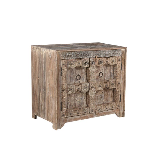 Handcrafted from antique Indian carved door panels and reclaimed wood, this distinctive Cabinet/Buffet features richly...