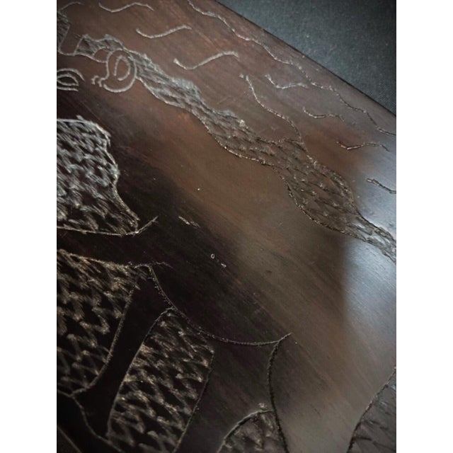 This exquisite antique tray is crafted from precious wood and features a hand-carved design depicting a rhinoceros in a...