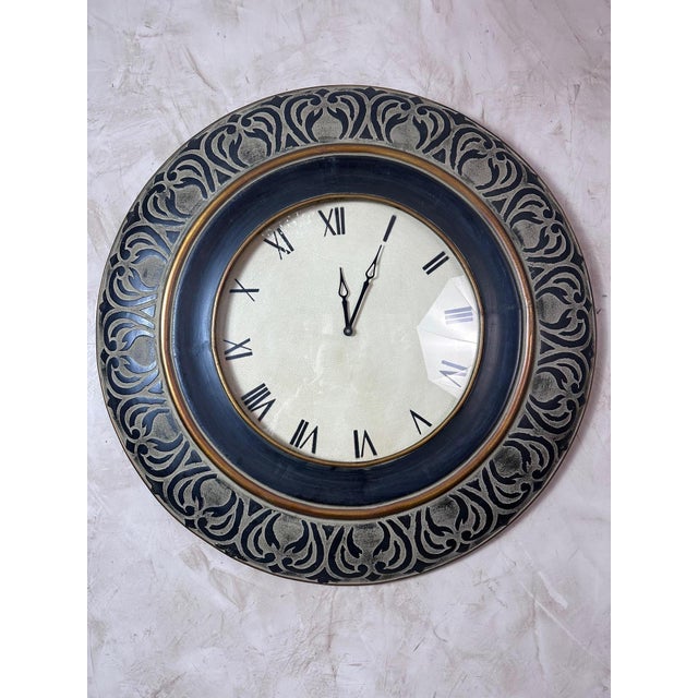 Large wall clock dating from the 2000s, crafted from wood with a striking decorative design. Its wide dial is framed by a...