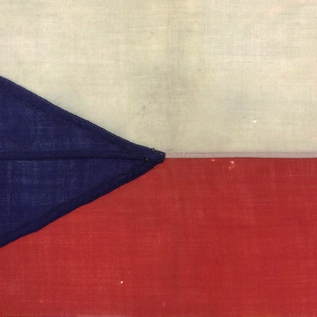 This vintage Czech Republic flag is fully sewn from a coarse woolen cloth. Please note staining, minor holes, and other...
