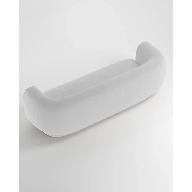 Hug sofa is defined by clean, simple lines and a distinctive armrest detail. The armrest, half overlapping the seat...