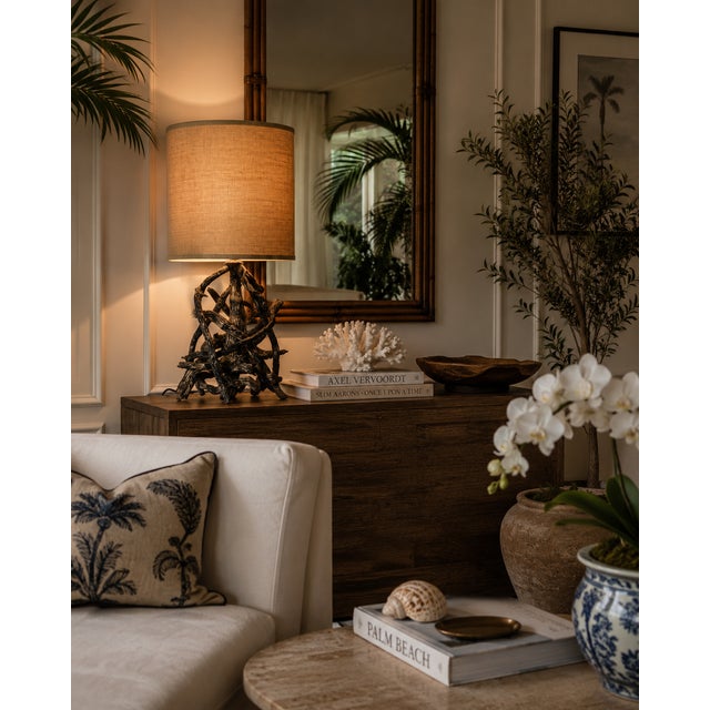 Elegant sculptural driftwood-style table lamp featuring an organic intertwined wood-form base paired with a classic...