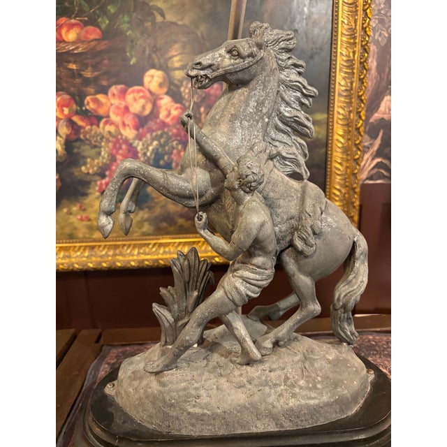 A striking late 19th-century spelter sculpture lamp depicting one of the celebrated Marly Horses, after the monumental...