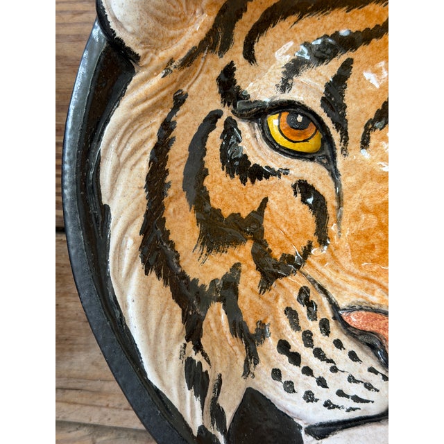 Striking vintage sculptural wall plate featuring a hand-painted tiger rendered in rich, dimensional glaze. Crafted in...