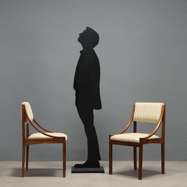 Chairs with a stained beech wood frame, foam padding, and fabric upholstery. The padding and upholstery need to be...